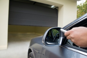 diver using button for her replace garage door