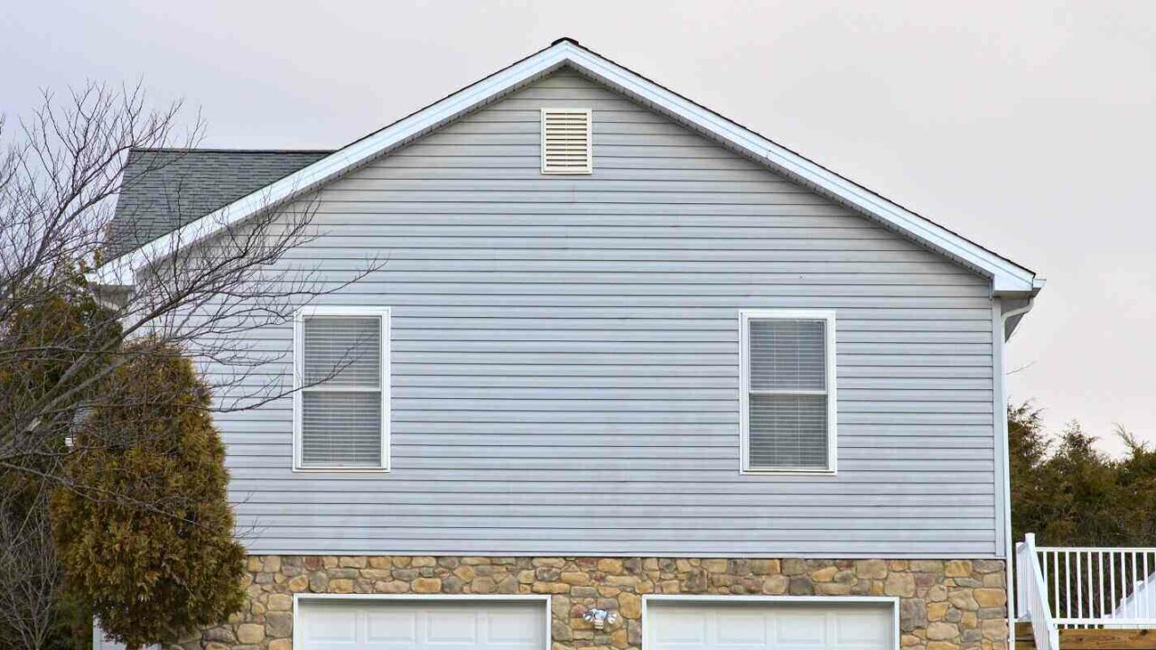 side view of a house blue vinyl siding