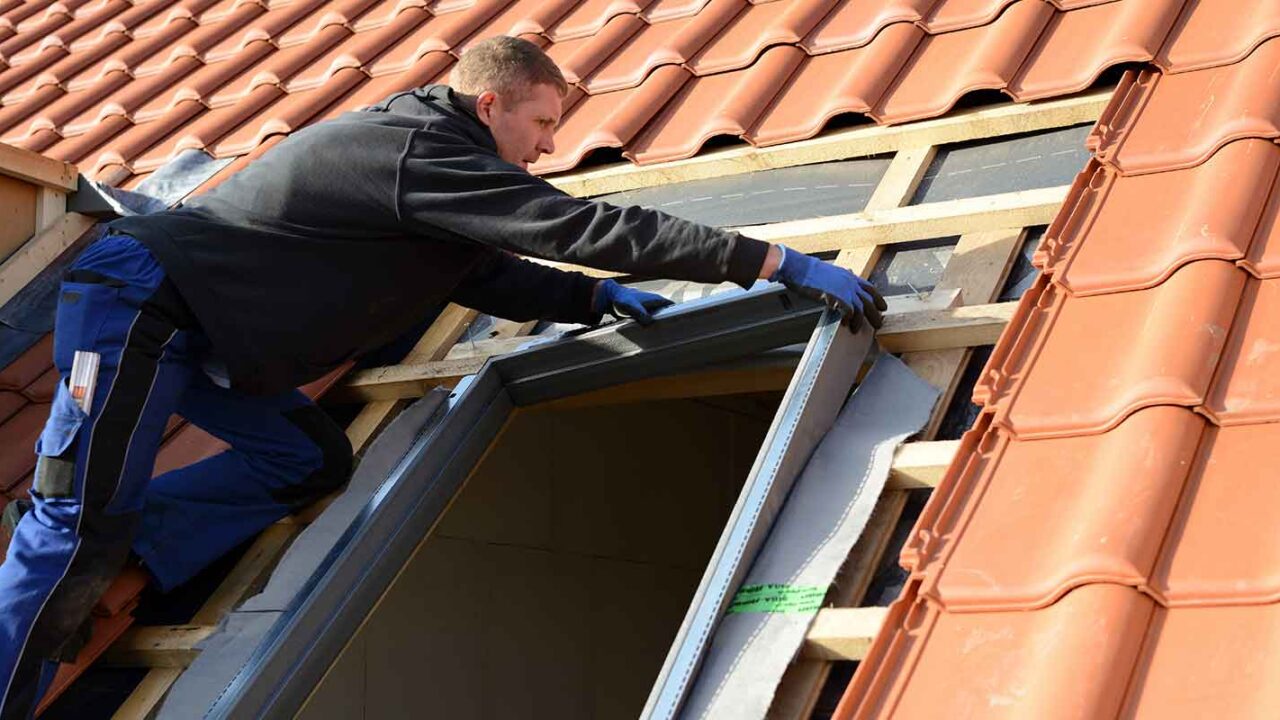 professional installing a skylight in a home