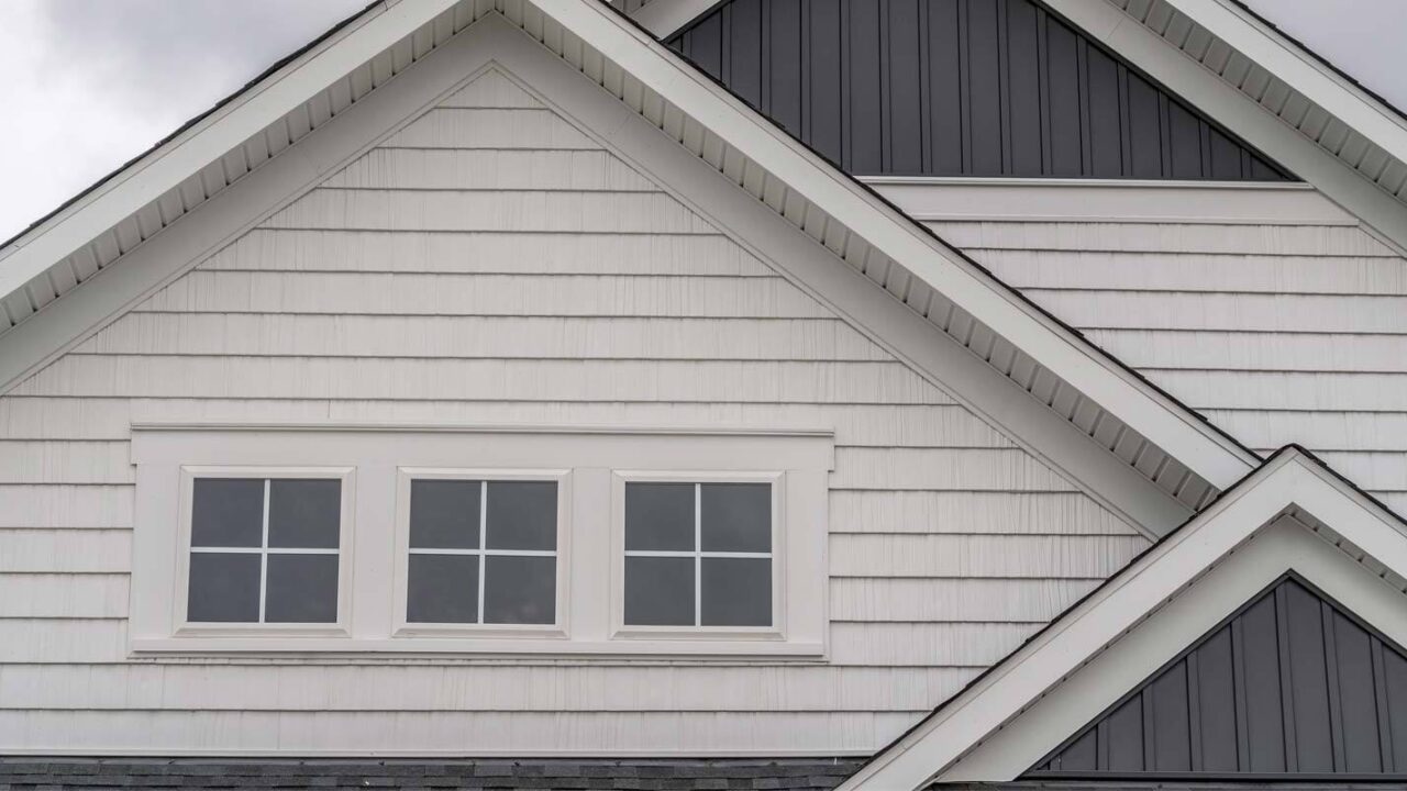 the front of a home that has mold underneath its siding