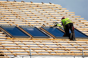 professional windows contractor installing skylight