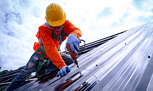 roofing professional on a roof working