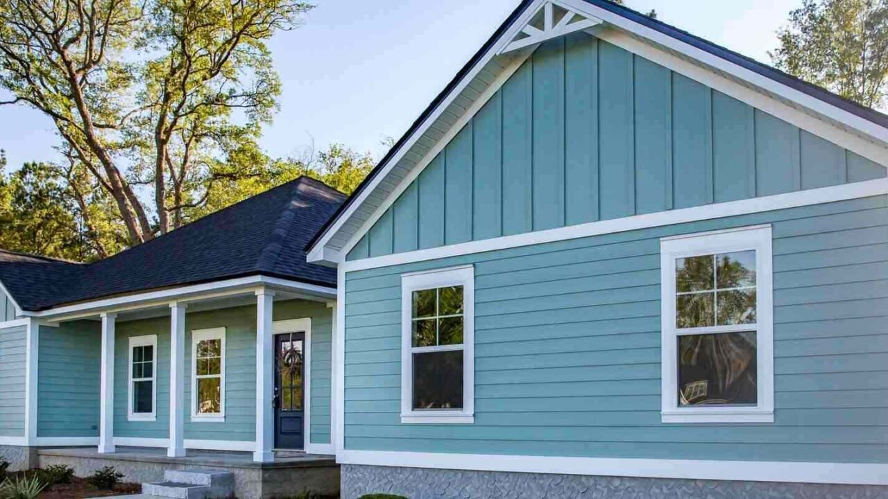 brand new construction house with blue vinyl siding