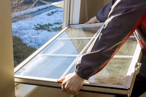 hands of the master repaired replaced the plastic break window during home renovation