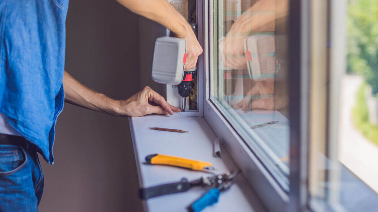 man replacing old windows