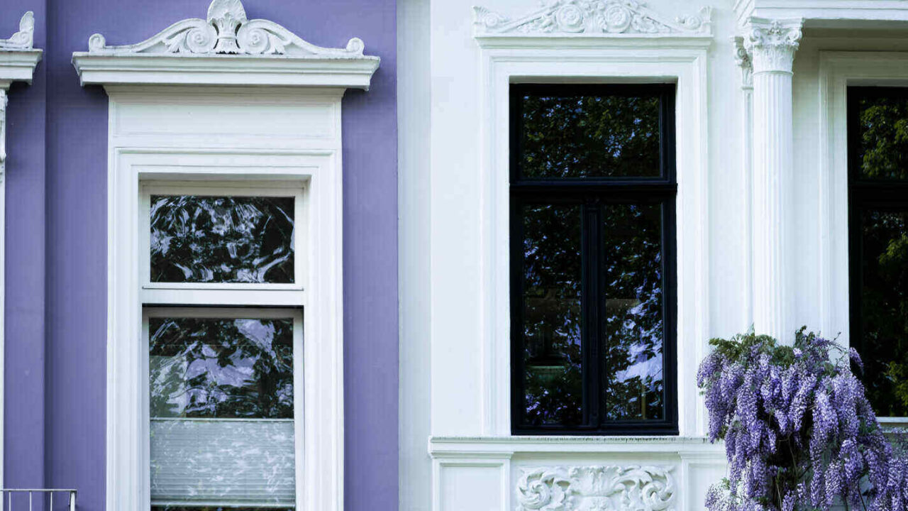 townhouse facade with syringa in spring