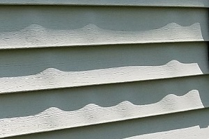 old vinyl siding warped