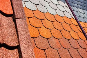 Samples of the roof of the roof. Bituminous tile of different types. Trade in building materials for the home.