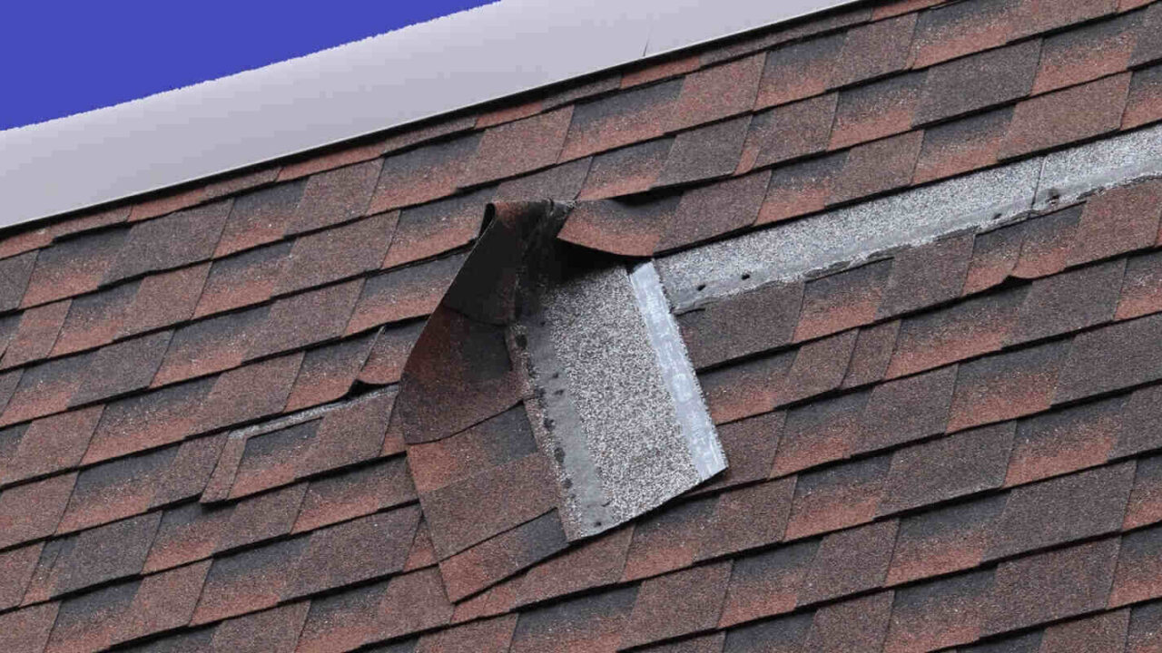 damaged brown roof shingle